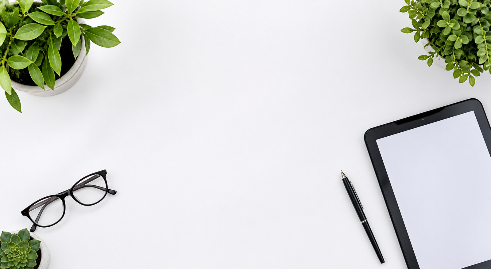A bright workspace with plants and a tablet